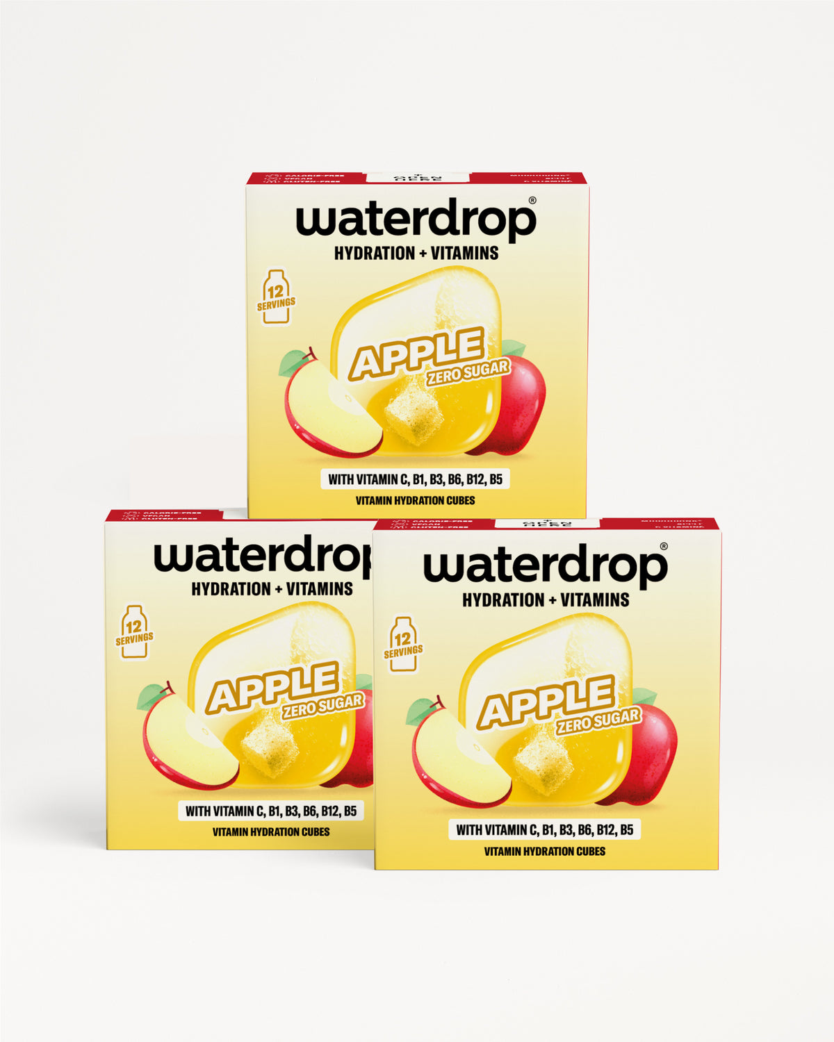 Három sárga Waterdrop doboz almás ábrával, háromszög alakban egymáshoz.