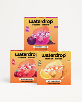 Három Waterdrop hidratáció és immunitás doboz felépítve piramisszerűen színes gyümölcsök képeivel.